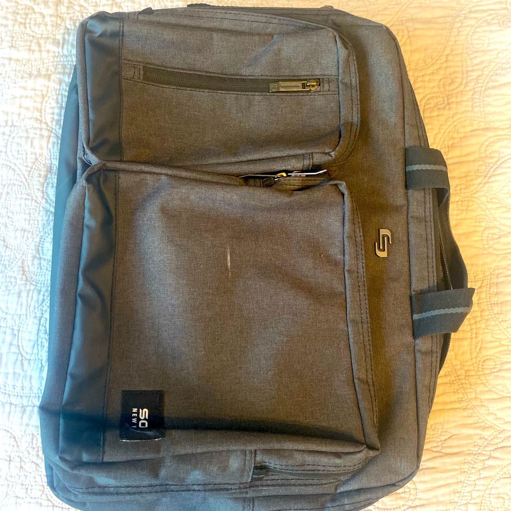 Perfect work bag that converts into briefcase or book bag.